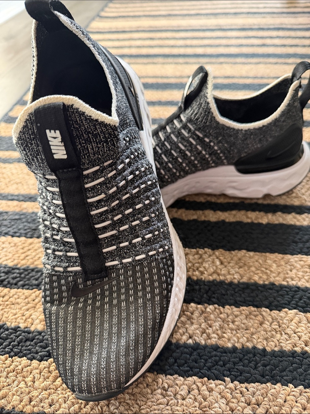 Nike Women’s Black and White Knit Slip-On Sneakers